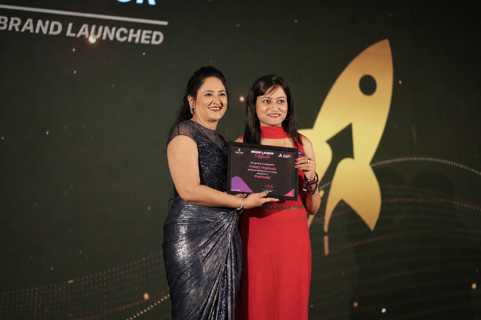 Preeti Prakash receiving the Brand Launch Certificate for Poshbella from her mentor